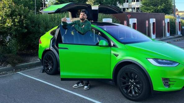 Nick Kyrgios with his Tesla. Picture Instagram