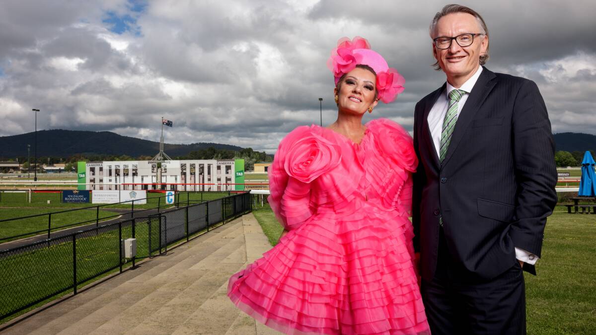Melbourne Cup Day fashions on the field judge Sarah Kelly and Canberra Racing CEO Darren Pearce. Picture by Sitthixay Ditthavong