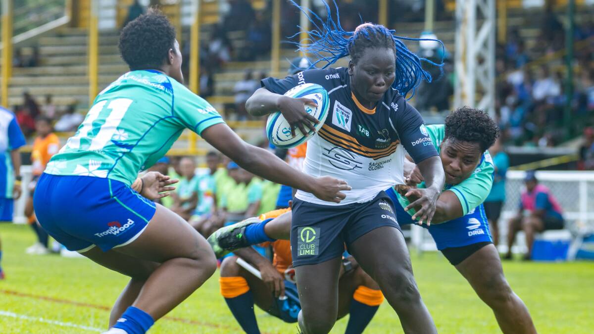 ACT Brumbies winger Biola Dawa takes on the Fijiana defensive line. Picture Getty Images