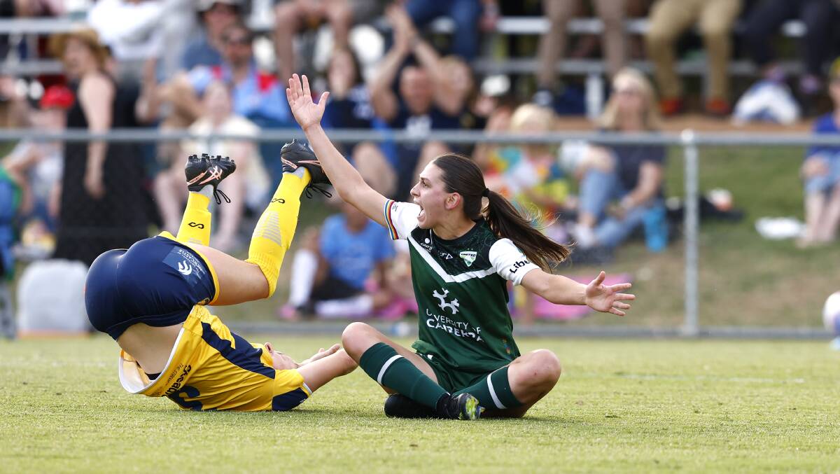 Canberra United's Sofia Christopherson appeals for a penalty after being brought down in a hard tackle. Picture by Keegan Carroll