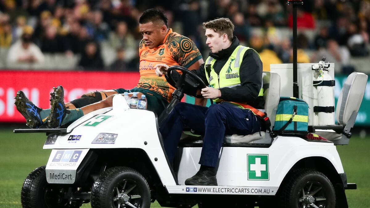 A dejected Allan Alaalatoa is taken from the field during Saturday's loss to the All Blacks. Picture Getty Images