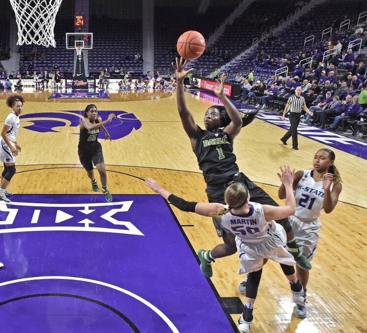 New Capitals recruit Dekeiya Cohen drives to the hoop while playing college basketball for Baylor University. Picture: Getty Images
