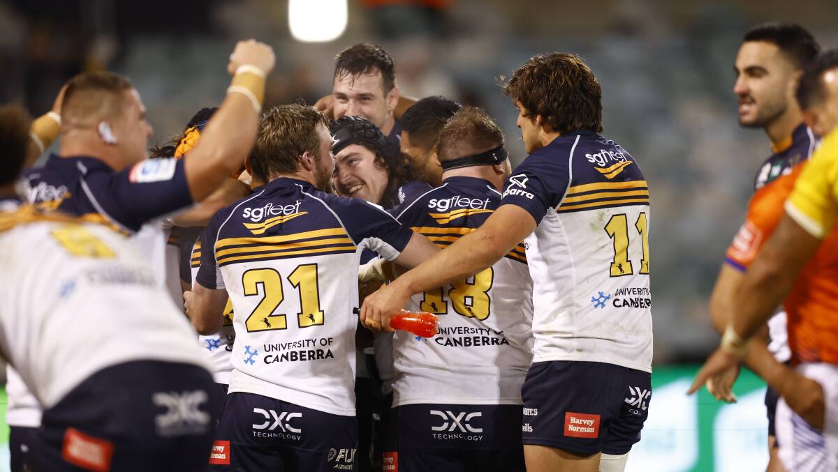 The Brumbies celebrate a famous, and dramatic, victory over the Hurricanes on Saturday night. Picture by Keegan Carroll