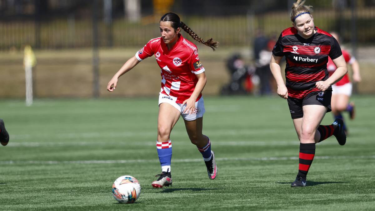 Canberra Croatia's Tatum Mazis carries the ball forward during Sunday's draw with West Canberra. Picture by Keegan Carroll