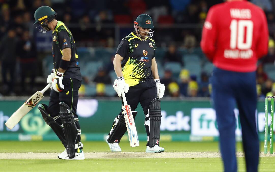 There were plenty of lessons in the rain for Aaron Finch (centre) and his Australian side on Friday night. Picture by Keegan Carroll