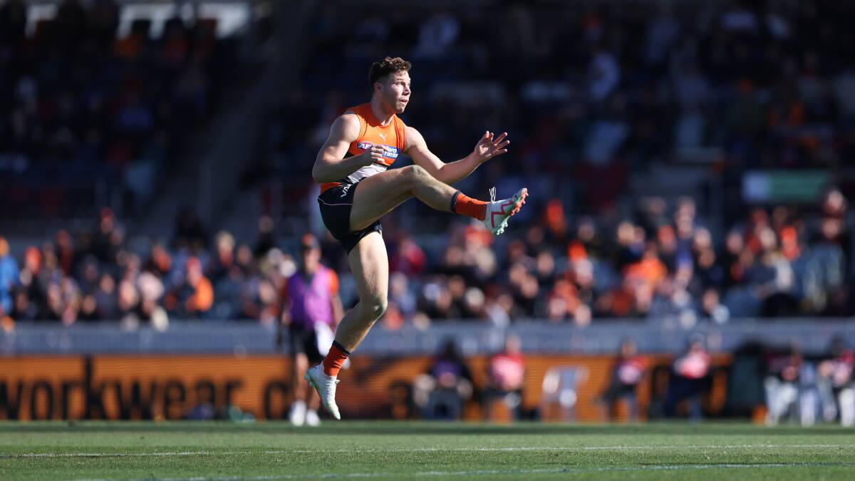 Toby Greene kicks for goal in GWS' commanding victory over the Suns at Manuka Oval. Picture by Sitthixay Ditthavong