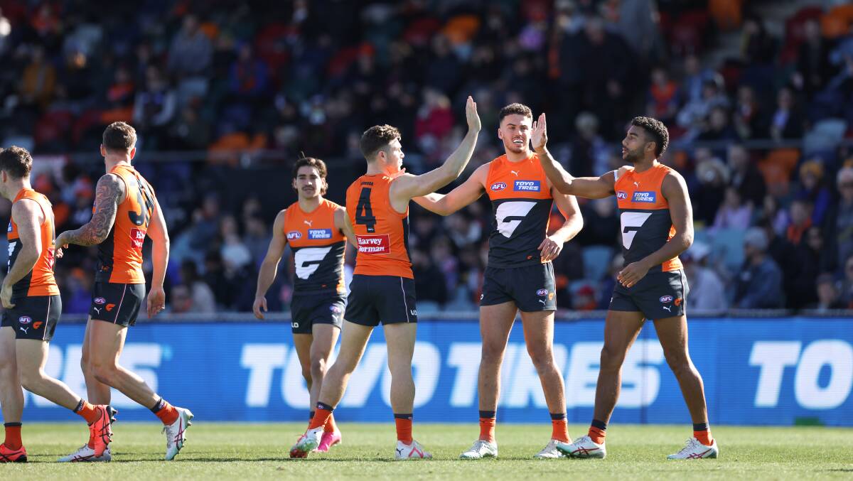 The GWS Giants celebrate a goal in Sunday afternoon's victory. Picture by Sitthixay Ditthavong