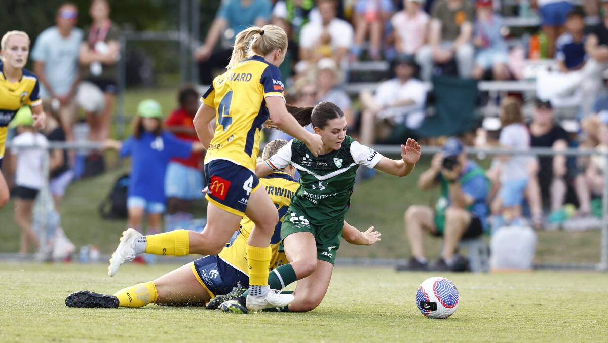 Canberra United's Sofia Christopherson is brought down in a hard tackle. Picture by Keegan Carroll