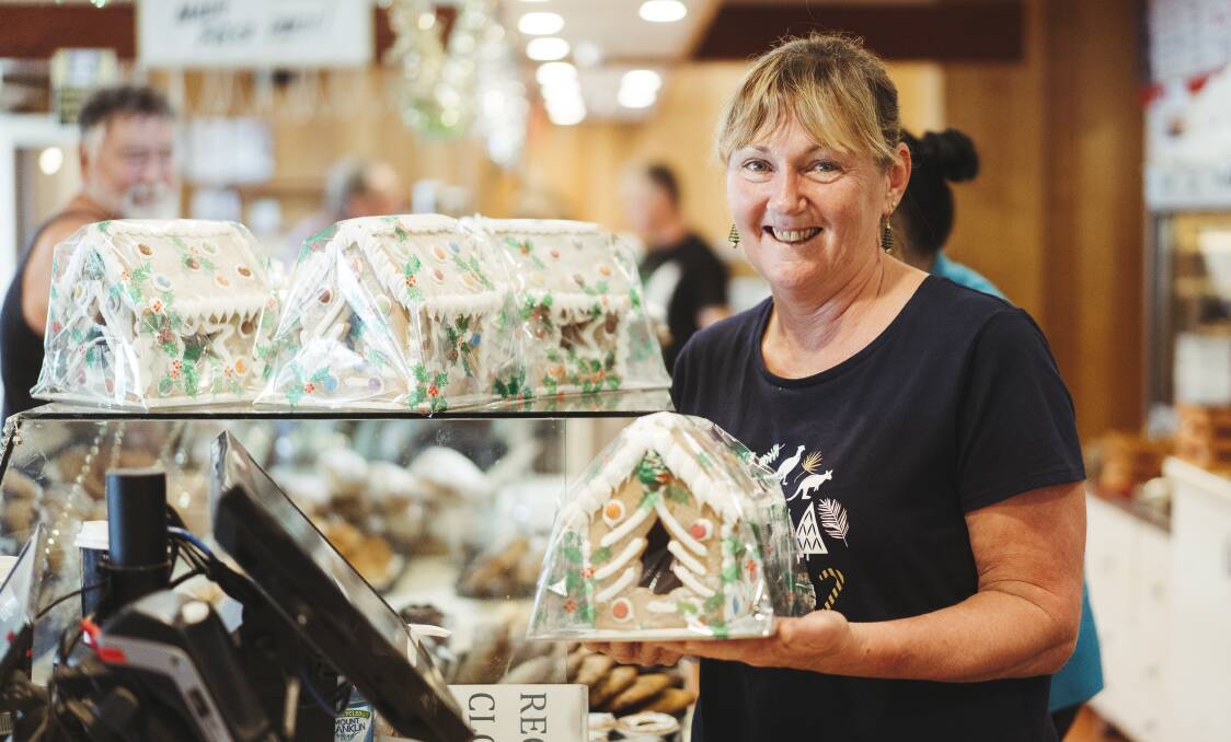 Braidwood Bakery manager Louise Moran showing off some of the Christmas hand made gingerbread houses. Picture: Dion Georgopoulos