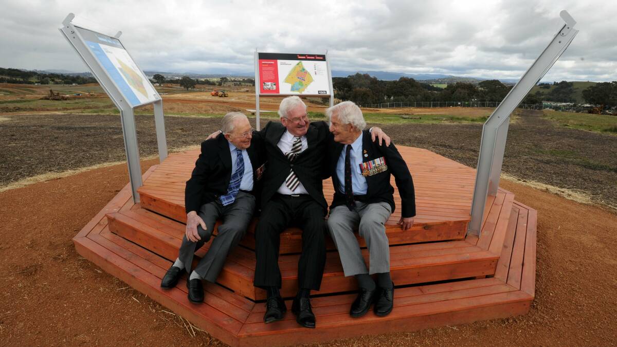 Battle of the Coral Sea veterans Gordon Johnson, left, and Derek Holyoake, right, with Ron Bell at the memorial in 2011. Picture: Richard Briggs.