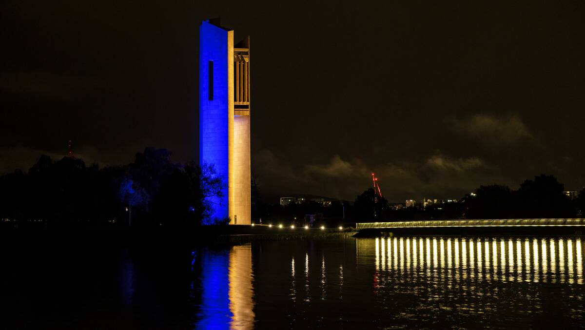The National Carillon was lit up in blue and gold in support of the people Ukraine on the weekend. Picture: Sitthixay Ditthavong