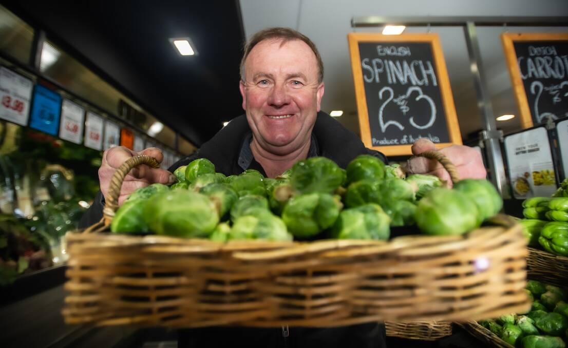 Ken Irvine of Ziggy's Fresh greengrocers with a basket of Brussels sprouts. Picture: Karleen Minney