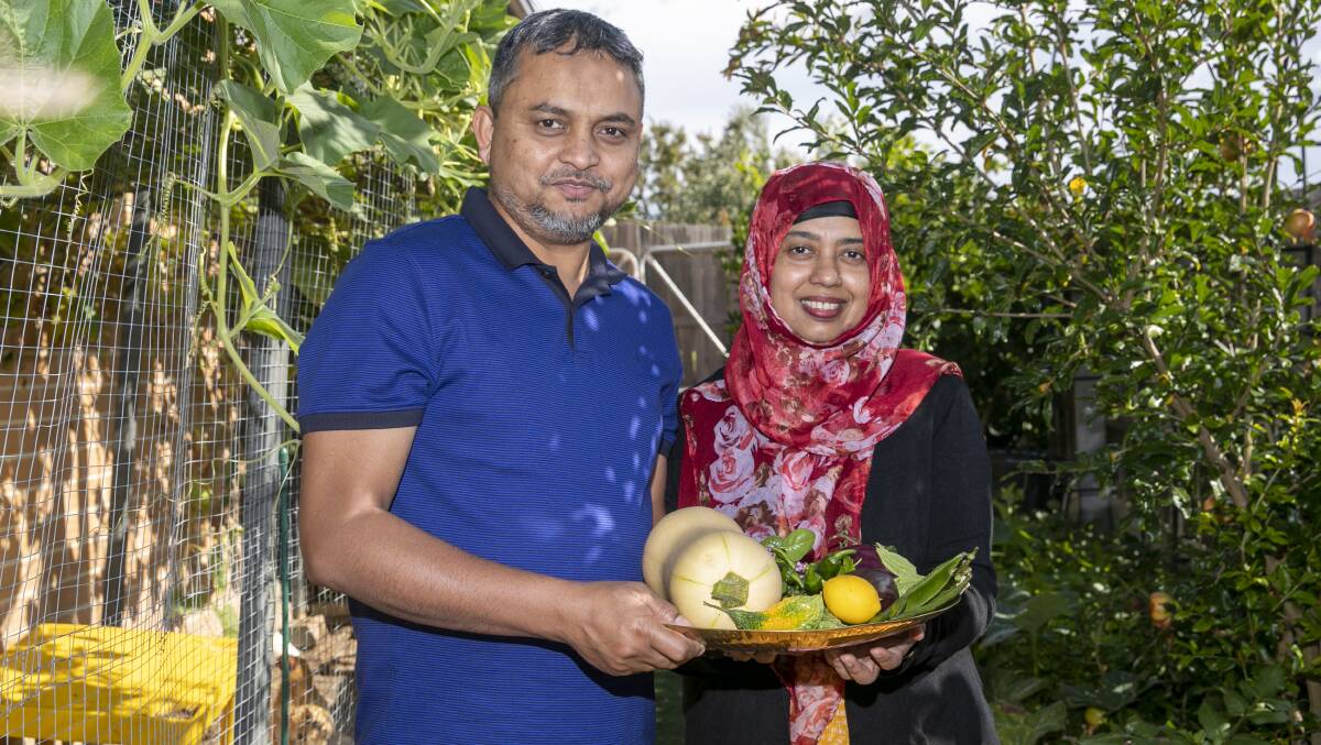 Maksud and Shoma Alam in their Bonner garden. Picture: Keegan Carroll
