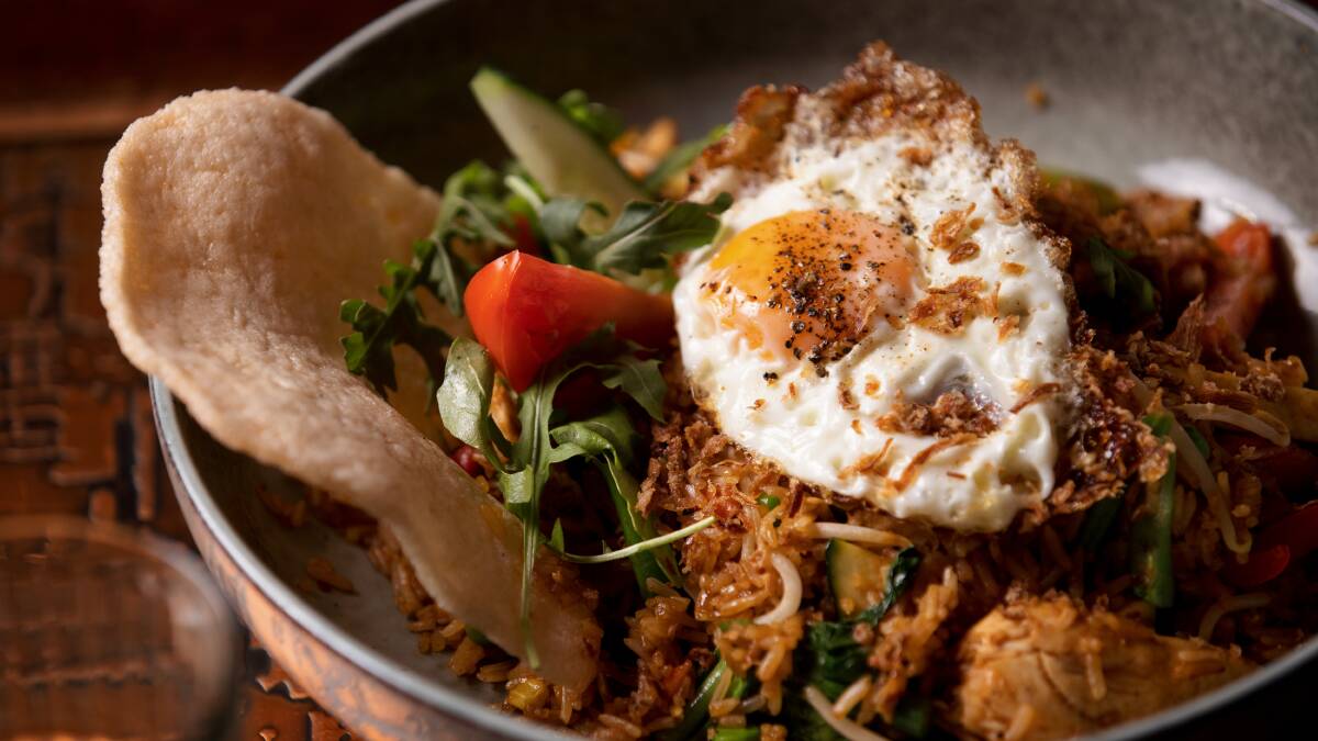 Nasi goreng. Kita fried rice prepared with kecap manis, spices, and topped with a fried egg. Picture: Sitthixay Ditthavong