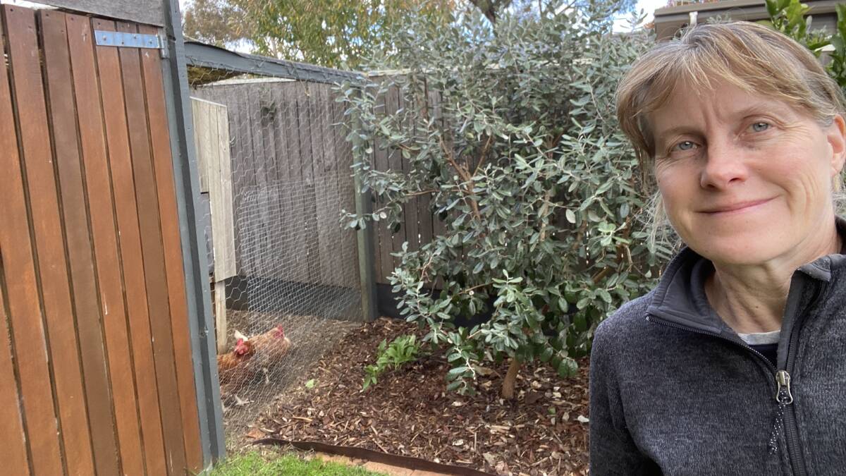  Pia Asa with her large feijoa bush near the chicken coop. Picture: Supplied