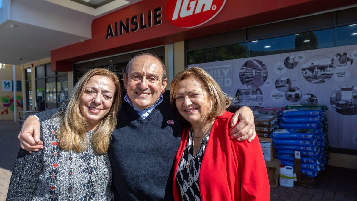 Irene Mihailakis, Manuel Xyrakis and Yvonne Dourdoulakis outside the Ainslie IGA. Picture by Gary Ramage
