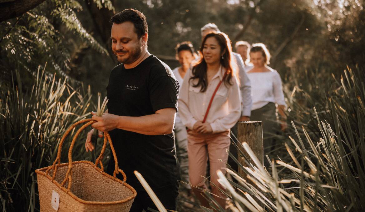 Executive chef Simon Evans, front, leads a foraging tour at Bangalay Luxury Villas. Picture: Supplied