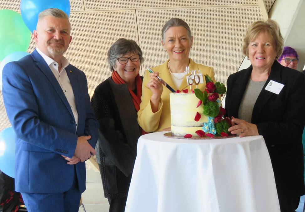Scott Saddler, Paulene Cairnduff, Helen Stevens and Lorraine Wilson at the cutting of the First Canberra Garden Club anniversary cake. Picture: Mary Lou Lyon