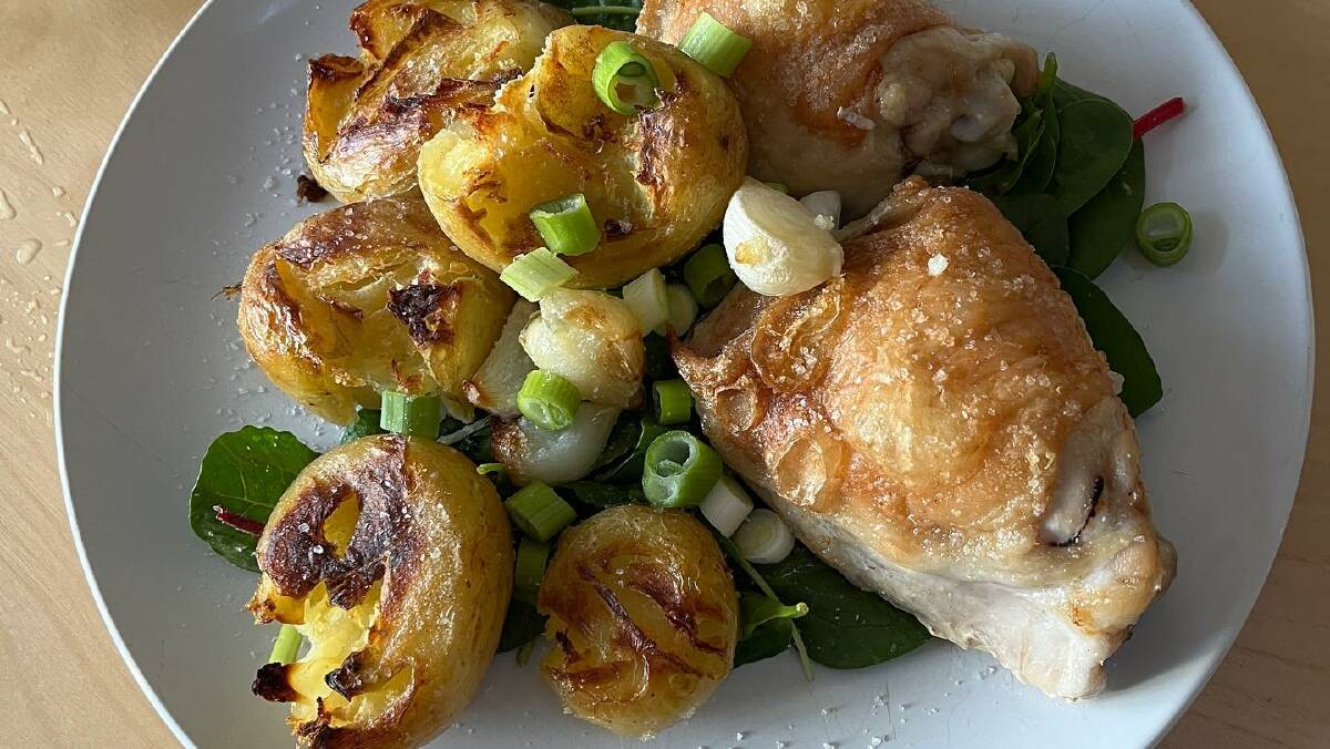 Karen Hardy's roasted home-grown garlic and potato with a chicken maryland or two. Picture by Karen Hardy 
