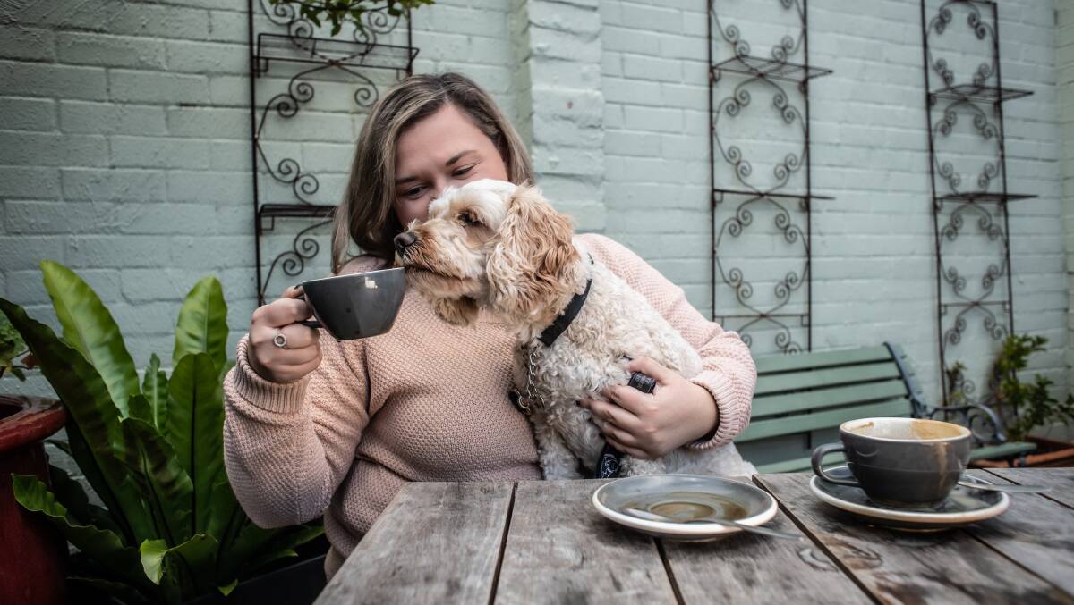 Kelsey Sutor and Orson in the dog-friendly courtyard at A Bite to Eat in Chifley. Picture by Karleen Minney