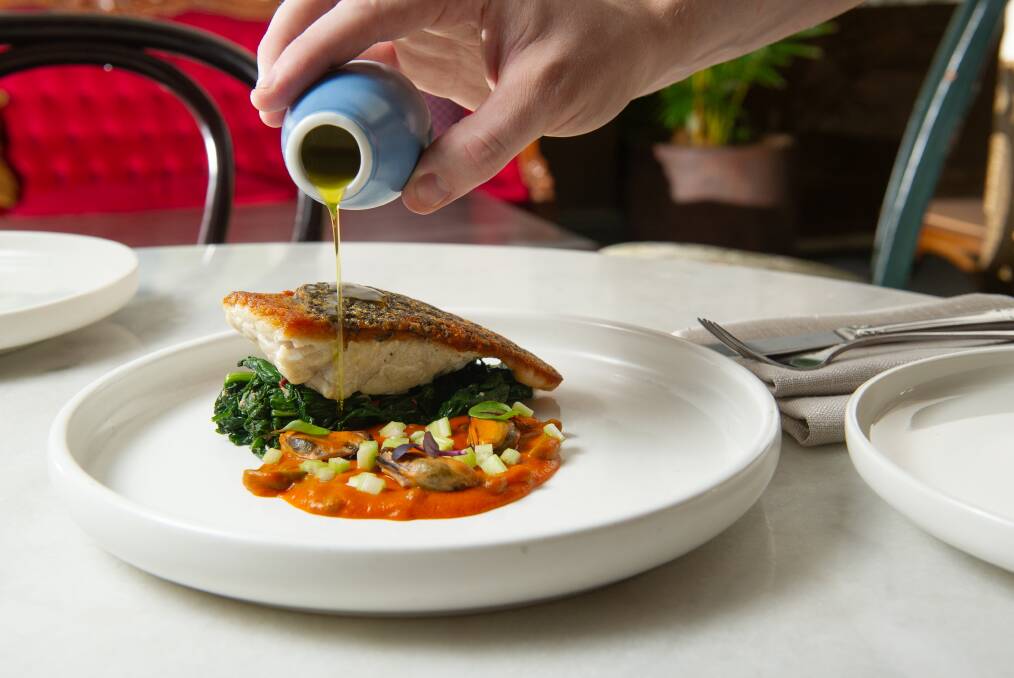 Barramundi with tomato bisque, pickled mussels, sauteed cime rapa. Picture by Elesa Kurtz