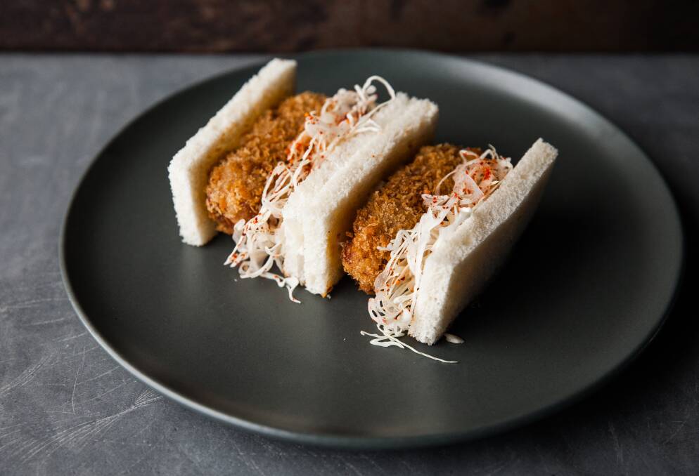 Pork loin katsu sandwich with house barbecue, cabbage slaw. Picture: Supplied