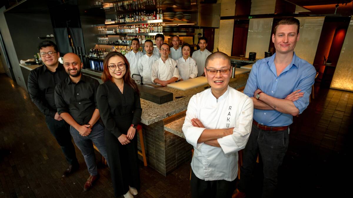 Restaurateur Hao Chen and general manager Nic Clarke, right, with the team at Raku which won restaurant of the year. Picture: Elesa Kurtz