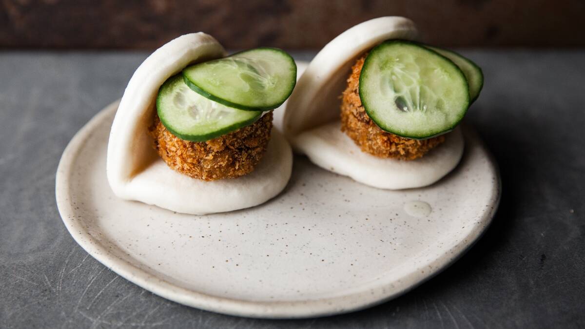 Steamed bao bun with duck croquette, pickled cucumber, kewpie. Picture: Supplied