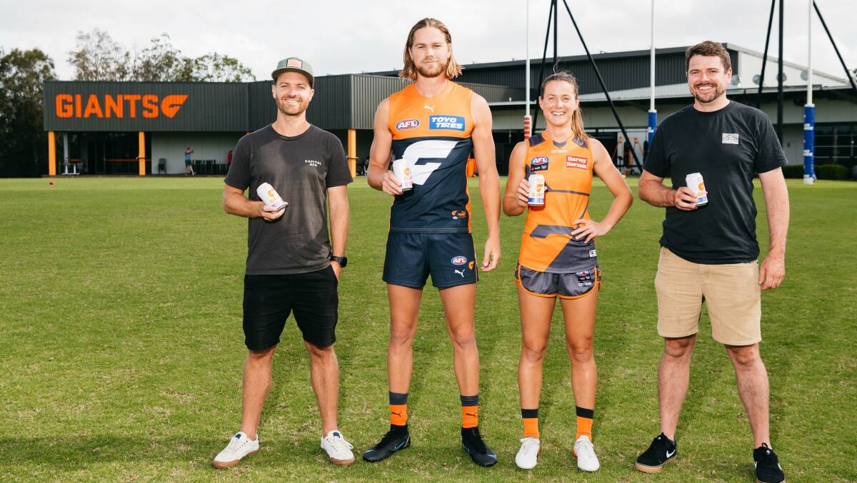 Tom Hertel and Laurence Kain with Giant's players Harry Himmelberg and Nicola Barr. Picture: Supplied