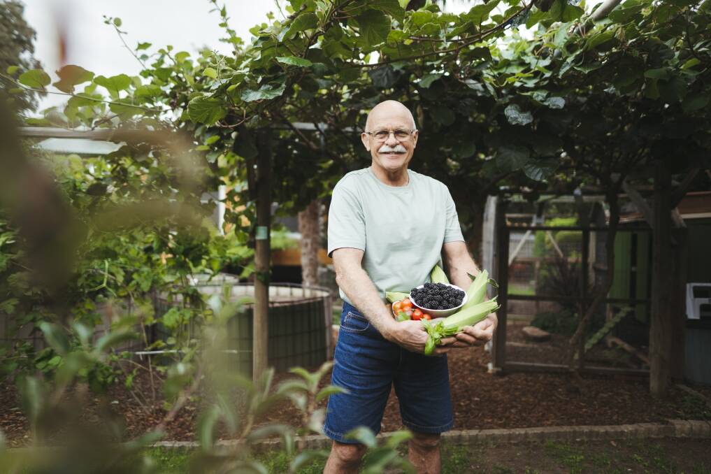 Brett Burdett among his fruit trees and kiwi fruit vines. Picture: Dion Georgopoulos