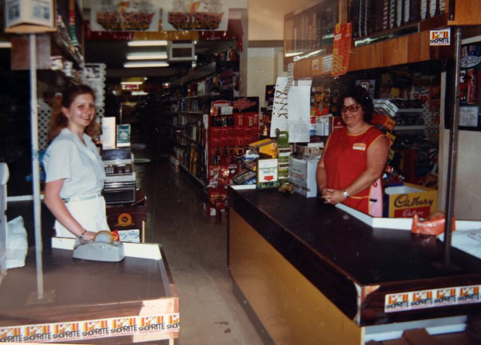 Busy working at the checkouts in 1982. Picture supplied