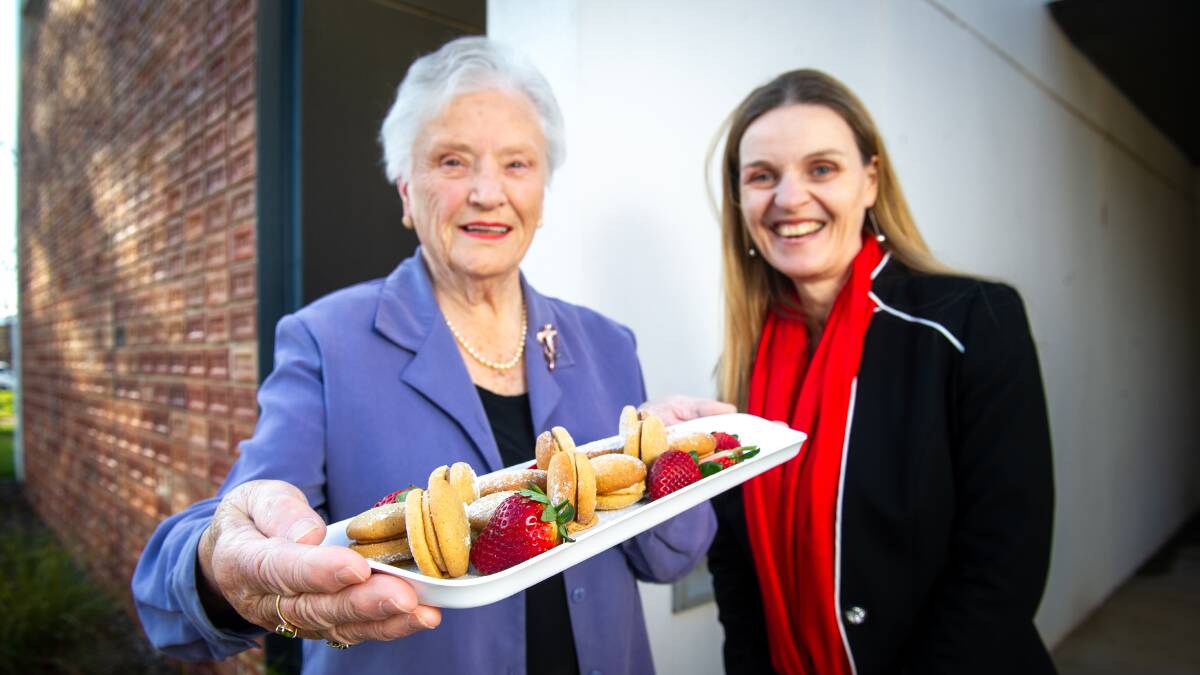 Joan Corkhill, with her Indian coffee creams, and Community Services #1's Amanda Tobler. Picture: Elesa Kurtz 
