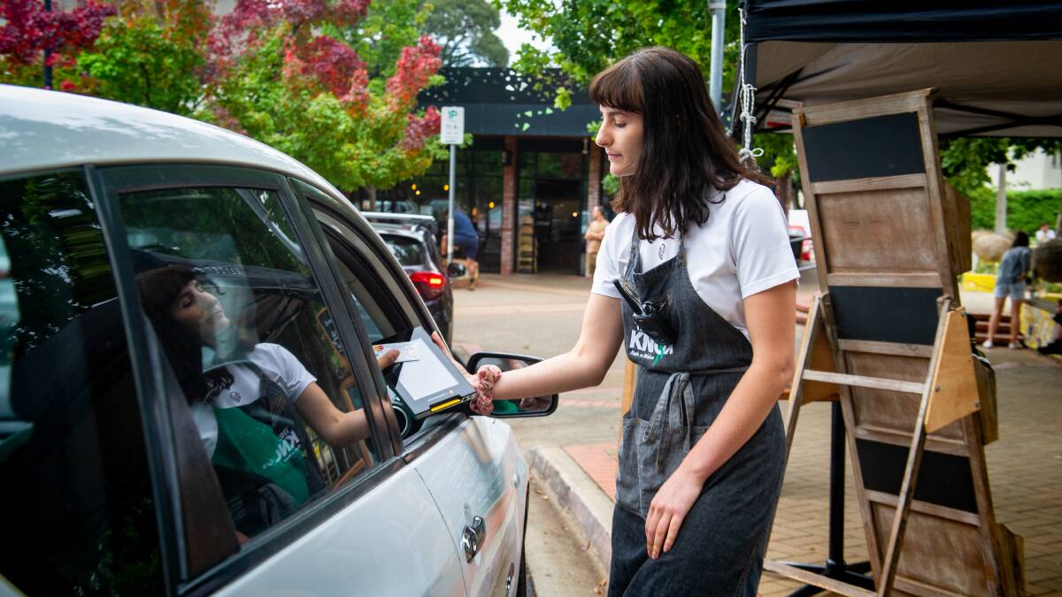 Staff member Liana Loncar attends the drive through at The Knox in Watson. Picture: Elesa Kurtz
