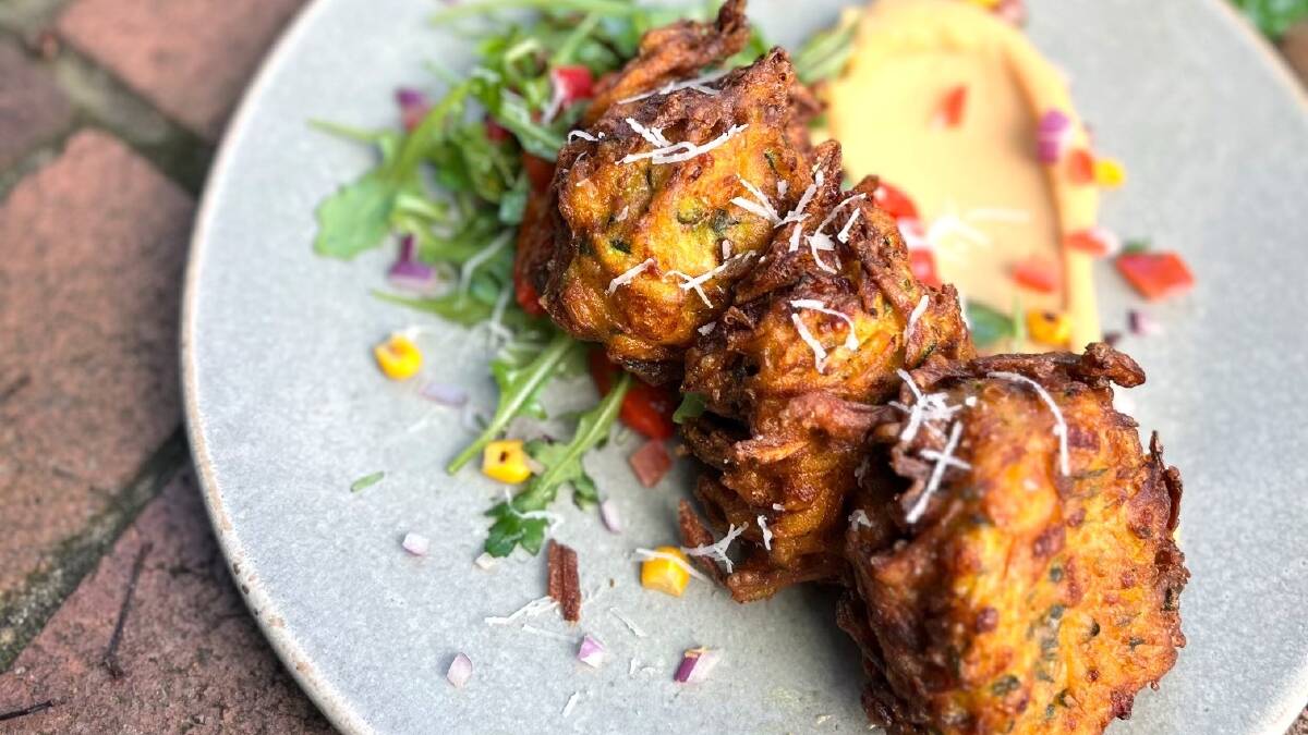 Pumpkin, zucchini and halloumi fritters with Moroccan bean puree. Picture supplied
