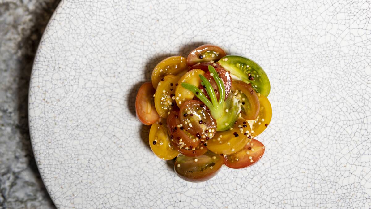 Cherry tomato salad, fried quinoa, honey soy, spicy tofu creme and beach bananas. Picture: Keegan Carroll