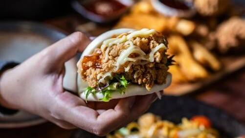 B One's fried-chicken offerings include bao with mayonnaise and sauce. Picture: Supplied