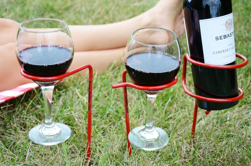 Wine sticks are an easy solution to hold glasses and bottles. Picture: Supplied