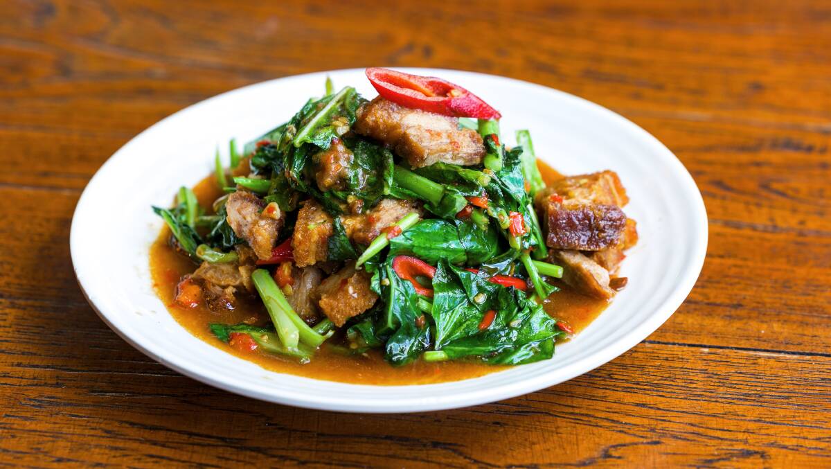 Stir-fried crispy pork with garlic, chilli, and Chinese broccoli. Picture: Sitthixay Ditthavong