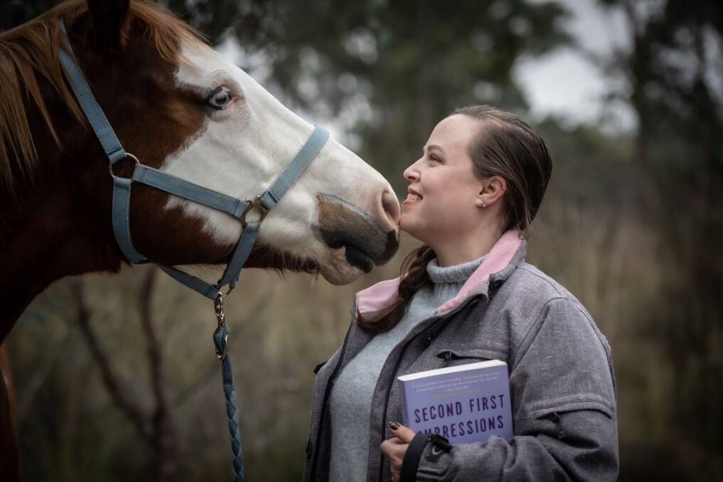 Sally Thorne takes time out from writing to hang with her horse Louie. Picture: Karleen Minney