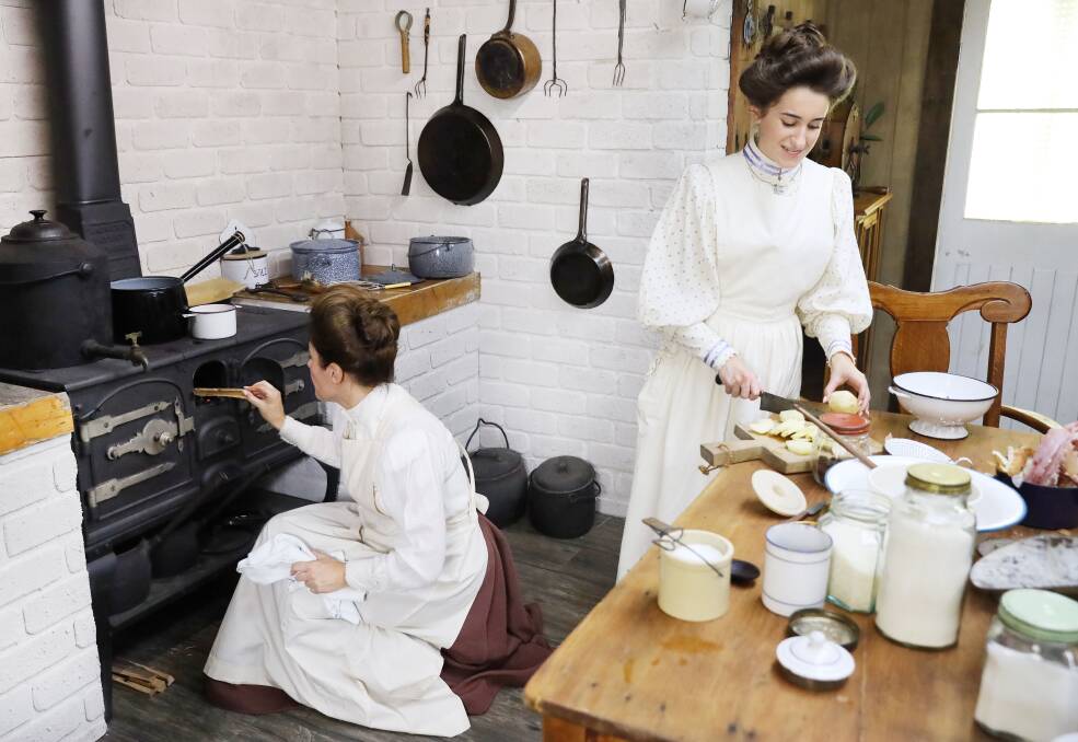 Carol and Sienna Ferrone cooking in their 1900s kitchen. Picture: Nigel Wright 