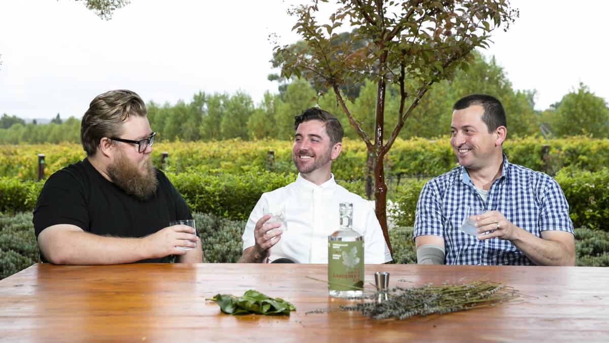 Pialligo's Aaron Rutter with executive chef Mark Glenn and Stewart Dobson of Underground Spirits with the Estate Gardeners Gin. Picture: Keegan Carroll