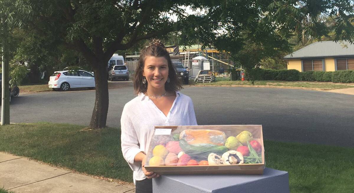Lauren Gregg from Highroad Cafe delivers the fresh produce box. Picture: Karen Hardy