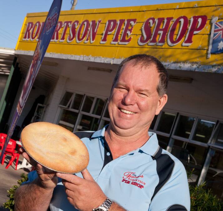 Steve Bleeker and the famous Robertson Pie Shop chunky beef pie. Picture: Supplied