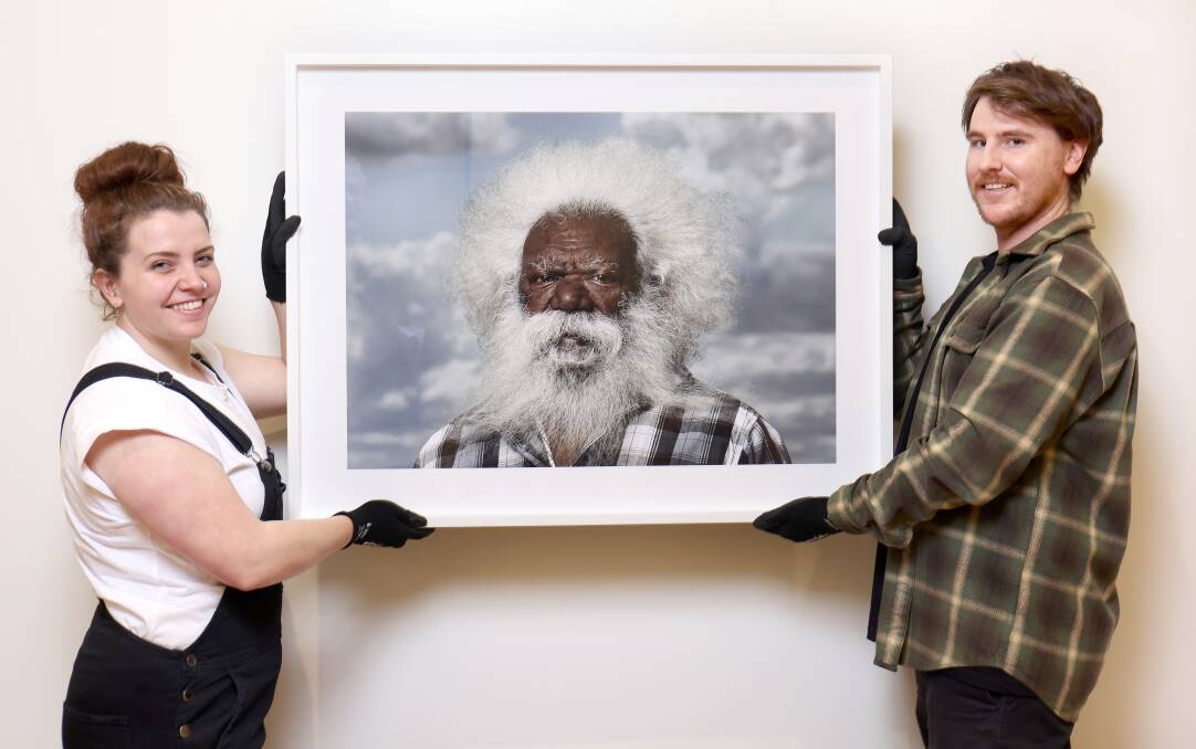 National Portrait Gallery collection officers Jess Kemister, left, and Jacob Potter with Adam Haddrick's Cordy in the Clouds 2021. Picture: James Croucher