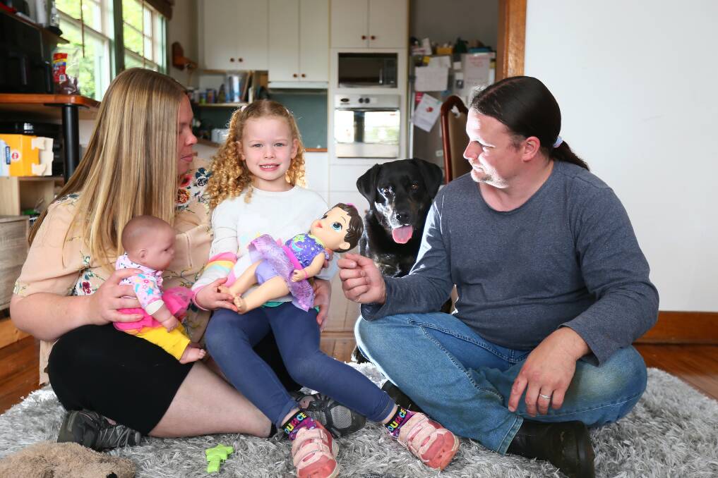 The Hawkins family of Adria, Michael and daughter Yuna with labrador Skittles, who they may have to give up for a chance at getting a new rental property. Daughters Sakura and Karliah not pictured. Picture by Rodney Braithwaite 