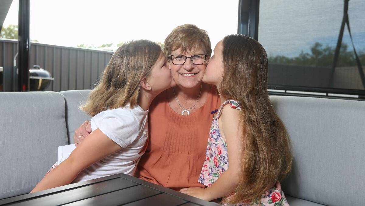 PROUD AS PUNCH: Pauline Gray is congratulated on her Tallangatta league life membership by grandchildren Nyla Grealy and Elle Martin. Picture: TARA TREWHELLA