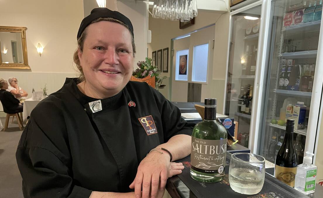Lee Cecchin, owner and chef at The Old Salt Bush Restaurant & Catering, with her saltbush gin - which is delicious served with lime and Mediterranean tonic water. Picture: Sarah Falson