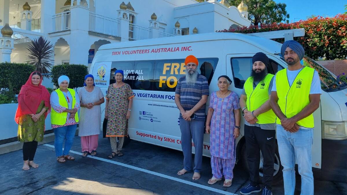 Members of Sikh Volunteers Australia and their delivery van outside of the gurdwara in Woolgoolga, NSW, where they prepared 1500 meals on Wednesday morning. Photo: Sikh Volunteers Australia.