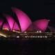 The sails of the Sydney Opera House are lit up with the colour pink as a tribute to Olivia Newton-John. Photos: AAP Image/Steven Saphore