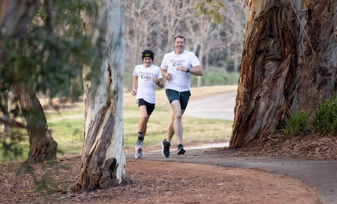 Ben and John Wilson train in Canberra in the build-up to the 777 Marathon. Picture: Sitthixay Ditthavong